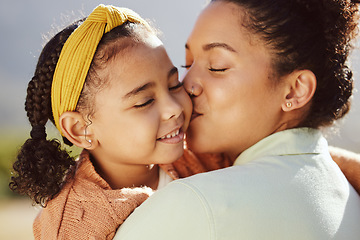Image showing Mother, child and kiss with smile for hug, love or care in family bonding, travel or summer break in the outdoors. Mama holding and kissing daughter for loving relationship or parenting in nature