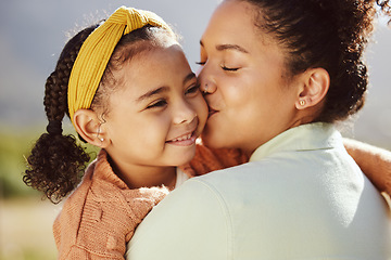 Image showing Love, family and mother and girl kiss in a park, happy and relax while bonding and embracing in nature. Happy family, kissing and mama with daughter on a trip in a forest, loving and caring in Mexico