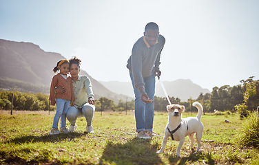 Image showing Dog, walking and family relax together in nature park enviroment. Black family, pet and father walk puppy in garden with mother and child for freedom, happiness and animal care on countryside field