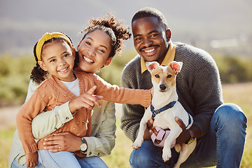 Image showing Family, portrait and dog at park with girl and parents relax, bond and play, happy and smile in nature. Black family, pet and having fun on a field, embrace and enjoy quality time with jack russell