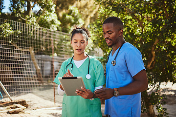 Image showing Doctors, tablet or diversity healthcare vet consulting for teamwork, medical or planning innovation research strategy in zoo. Medicine, insurance or nurse working on tech, data analysis or review