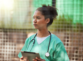 Image showing Veterinary, nurse of healthcare woman outdoor with tablet and stethoscope for inspection or to check medical records. Vet, veterinarian or doctor in uniform using technology for research or schedule