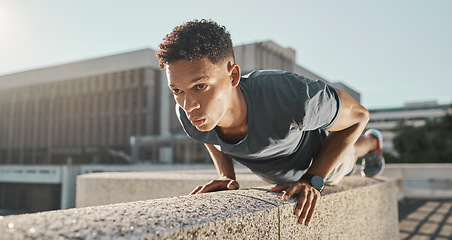 Image showing Exercise, black man and push ups outdoor at workout, fitness and focus for wellness, health and training. Motivation, young male and athlete in city, healthy and practice in sportswear and strong