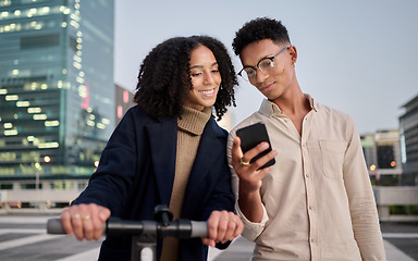 Image showing Couple, friends or students in city with phone travel for communication, networking or social media. Electric scooter, happy or black woman and man on smartphone for 5g network, contact us or app
