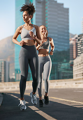 Image showing Fitness, exercise and friends running in the city together for an intense cardio workout in street. Sports, athletes and women runners doing outdoor training for marathon or competition in urban town