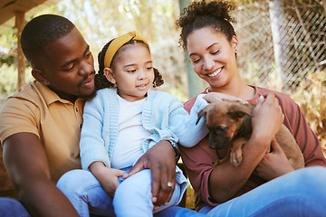 Image showing Happy family, animal shelter and dog with girl and parents bond, relax and sharing moment of love, trust and care. Black family, animal rescue and puppy with family at shelter, playful, cute and joy