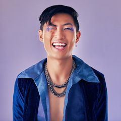 Image showing Punk, rock and makeup of a man with a smile for metal music, lifestyle and identity against a purple studio background. Freedom, crazy and face portrait of a cyberpunk Asian person with cosmetics