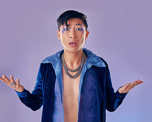 Image showing Shock, surprise and gay man with makeup in studio isolated on a purple background. Cosmetics, cyberpunk and lgbtq, queer and punk male model from Japan with omg, wow or shocked facial expression.