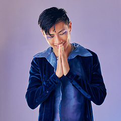 Image showing Man, fashion makeup or punk rock hands in thank you, welcome or Japanese greeting on creative purple background studio. Smile, happy or artistic musician cosmetics, vintage clothes or prayer gesture