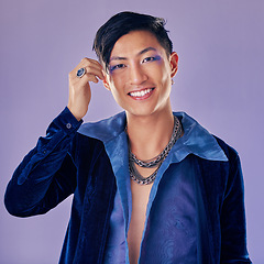 Image showing Man, makeup and luxury fashion aesthetic for lgbtq cosmetic skincare wellness. Retro beauty Asian model, facial portrait and gen z pop art clothing design or vintage style in purple background studio