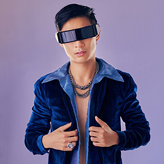 Image showing Asian, man and vr with future glasses in studio for aesthetic, jewelry or cyberpunk by lavender wall. Futuristic fashion model, metaverse and metal jewellery in sci fi sunglasses for virtual reality