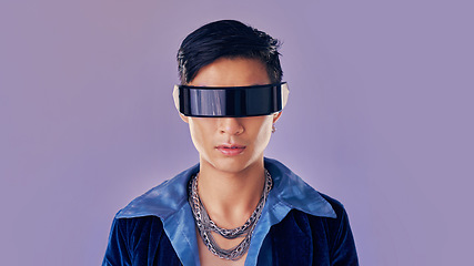 Image showing Face, cyberpunk and virtual reality with asian man in futuristic eyewear in studio on purple background for metaverse or 3d fashion. Portrait, robot and future of young male in glasses for fantasy ai