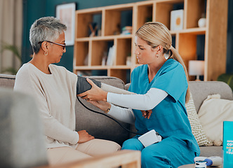 Image showing Healthcare, blood pressure and woman with doctor, home test on sofa or doctors visit in apartment living room. Senior care, nurse or caregiver with patient, trust and support in medical house call.