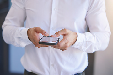 Image showing Phone, communication and networking in the hands of a business man in the office for corporate work. Mobile, contact and social media with a smartphone in the hand of a professional working employee