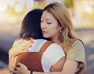 Image showing Love, women and hug for connect, sad and support for understanding with problem, compassion and calm together. Asian woman, girl and embrace friend, loving and help to console in kind relationship