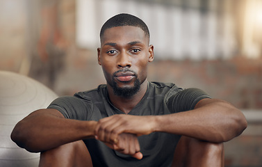 Image showing Black man, fitness and exercise in gym, break and rest after sports workout. Health portrait, wellness and serious commitment from strong male from France with focus after training