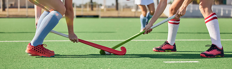 Image showing Fitness, sports and hockey with women on field and training for competition, challenge and workout. Battle, games and exercise with shoes of hockey player and sticks in stadium for workout and health