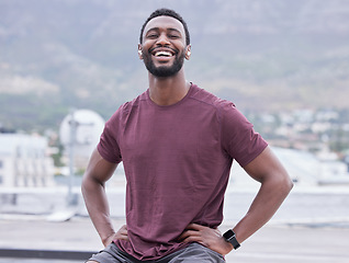 Image showing Portrait, black man and relax with smile in city happy, pride and confidence with positive mindset. Fitness, African American young male and guy being trendy, edgy and casual outdoor with happiness.