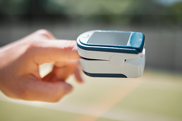 Image showing Hand, health and pulse oximeter in nature for oxygen measurement. Healthcare, wellness or SPO2 meter on finger of person to check, monitor or test blood levels or heart rate outdoors at park outside