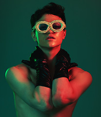 Image showing Fashion, model and accessories of a gen z, stylish and fashion model man with glasses aesthetic. Portrait of beauty, designer sunglasses and luxury gloves inspiration looking cool with red light