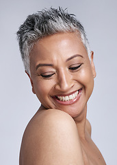 Image showing Face, beauty and skincare with a senior woman in studio on a gray background for wellness or natural care. Health, cosmetics and antiaging with a mature female posing for dermatology or cosmetology