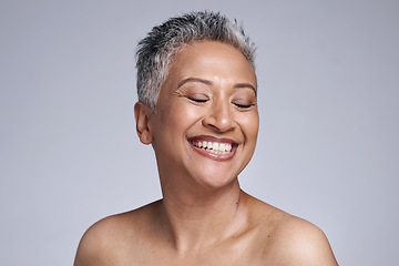 Image showing Happy senior model, beauty and makeup face for cosmetics, health and skincare by studio backdrop. Elderly black woman, skin wellness and radiant cosmetic glow, anti aging and smile by grey background