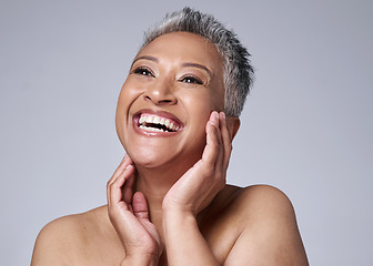 Image showing Face, beauty and skincare with a senior woman in studio on a gray background happy with an antiaging treatment. Wellness, cosmetics and skin with a mature female inside to promote natural facial care