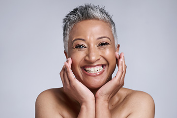 Image showing Beauty, skincare and portrait of senior woman in studio on gray background. Makeup cosmetics, smile and happy mature female model from India touching face for facial or healthy skin treatment routine