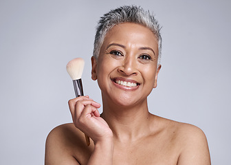 Image showing Beauty, makeup and brush with senior woman for wellness, product and salon cosmetics. Foundation, self care and luxury with smile portrait of face of mature model for health, cosmetology and skincare