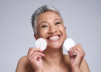 Image showing Skincare, portrait and senior woman with cotton pad for natural, anti aging and beauty routine. Cosmetic, health and face of happy elderly lady with skin treatment isolated by gray studio background.