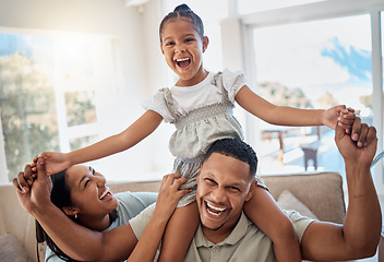 Image showing Happy family, smile and piggyback playing on sofa for quality bonding or relaxing together at home. Mother, father and child smiling for joy in playful fun and family time on the living room couch