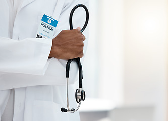 Image showing Doctor, stethoscope in hands and hospital healthcare professional in medical lab coat for checkup support, health exam and breathing test. Cardiology wellness, black man clinic worker and leadership