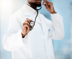 Image showing Doctor, cardiologist and stethoscope for healthcare of a medical, checkup for health and wellness in a hospital. Hand of black man listening to breathing and heart for cardiology and health insurance