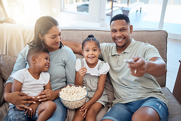 Image showing Parents, kids and happy family watching tv, movie and media, tv show and cartoon film in home lounge, living room sofa and house. Happy family relax with popcorn, television streaming and multimedia