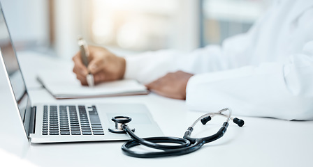 Image showing Laptop, stethoscope and doctor writing in notebook for research planning or medical tech innovation in hospital office. Healthcare medic worker, research strategy book notes and online communication