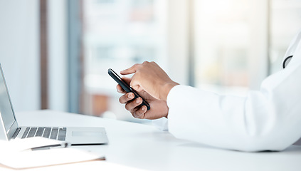 Image showing doctor, laptop and hands with phone for online communication in hospital office. Man, healthcare innovation and medical science doctor or cardiology research on internet tech mobile smartphone