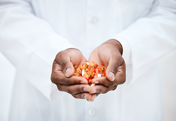 Image showing Hand, pills and doctor holding medicine for cancer treatment closeup in a medical clinic. Supplements, vitamins and antibiotics capsule or pill for medicare with open hand of pharmacist