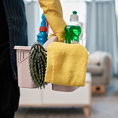 Image showing Cleaning product, chemical and basket with woman in living room to clean bacteria, dust and dirt during spring cleaning at home. Cleaning service, cleaner or maid with container to work in room