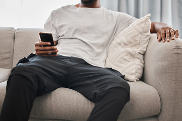 Image showing Social media, relax and man on the sofa with a phone for communication, internet and mobile app chat. Website, connection and person on the couch with a mobile, wifi and search of the web in his home
