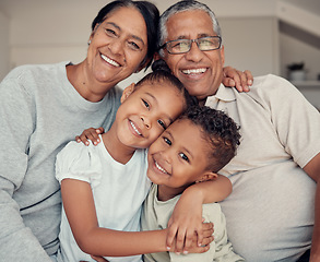 Image showing Family portrait, happiness and love of children and grandparents with a smile, hug and support while together on a living room couch at home. Face, care and happy kids with a senior man and woman