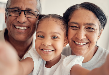 Image showing Phone selfie of child, grandparents or happy family bonding, having fun and enjoy quality time together at home. Love, smile and photo memory portrait of grandmother, grandfather and young kid girl