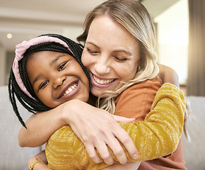 Image showing Portrait, family and adoption with a girl and mother hugging in a living room of their house together. Face, love and children with a foster parent woman and daughter embracing while bonding at home