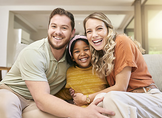 Image showing Adoption, love and parents with a hug for child on the sofa in the living room of family home. Happy, care and portrait of African girl kid with affection from mother and father in interracial house