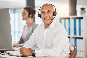 Image showing Portrait, call center and customer service employee in office at desk with smile. Consultant, contact us or male sales agent, telemarketing or crm, help desk or support worker consulting in workplace