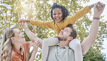 Image showing Family, adoption and piggyback in the park with a girl and foster parents having fun together in the park. Diversity, playful and freedom with a mother, father and daughter bonding outdoor in nature