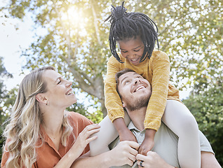 Image showing Family, happiness and nature park with mom, dad and a child together outdoor for love, care and support after adoption of foster girl. Smile, trust and happy man, woman and kid on vacation to relax