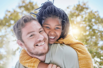 Image showing Family, happiness and adoption with a father and child outdoor with trust for piggy back ride for love and support with a smile in summer. Portrait of a man and foster kid in a nature park for fun