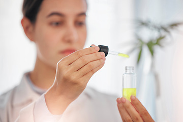 Image showing Science, product and beauty oil by woman beautician with skincare, cosmetic and breakthrough research at a clinic. Hands, serum and wellness expert working on collagen treatment for acne and skin