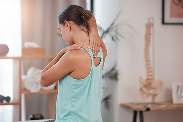 Image showing Chiropractor, physiotherapy and injury with a woman client stretching in an office for movement or mobility. Rehabilitation, recovery and pain with a female patient at the physio for healing