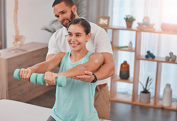 Image showing Physiotherapy, exercise and dumbbells with a man therapist and woman client in a rehabilitation session. Fitness, health and consulting with a female patient in recovery training with a male physio